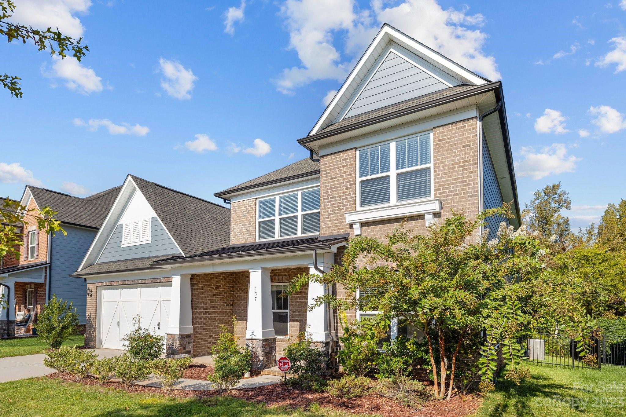137 Hampton Trail Drive Fort Mill, SC 29708 - Photo 3 of 48 a front view of a house with garden