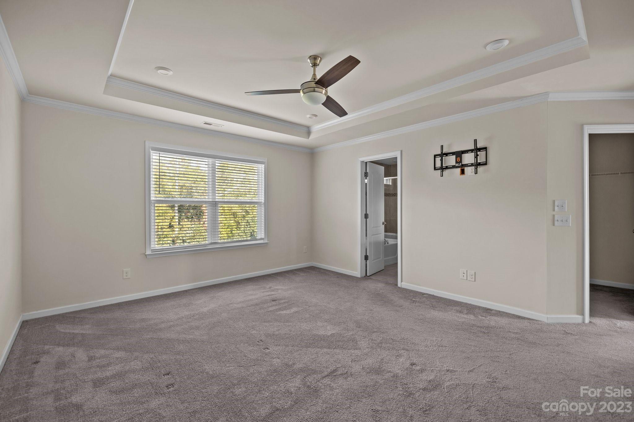 137 Hampton Trail Drive Fort Mill, SC 29708 - Photo 33 of 48 an empty room with windows and ceiling fan
