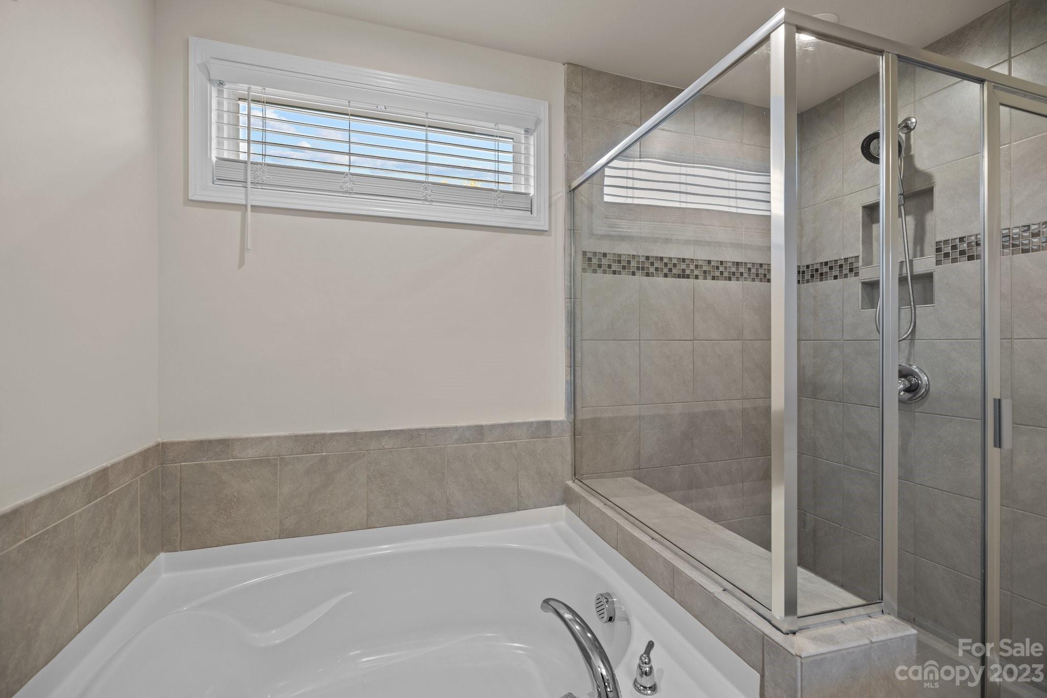 137 Hampton Trail Drive Fort Mill, SC 29708 - Photo 35 of 48 a bathroom with a bathtub and shower