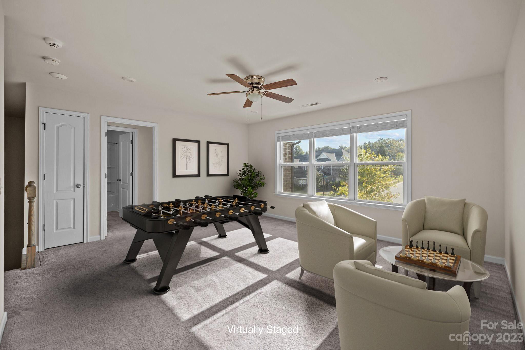 137 Hampton Trail Drive Fort Mill, SC 29708 - Photo 36 of 48 a living room with furniture a window and a ceiling fan