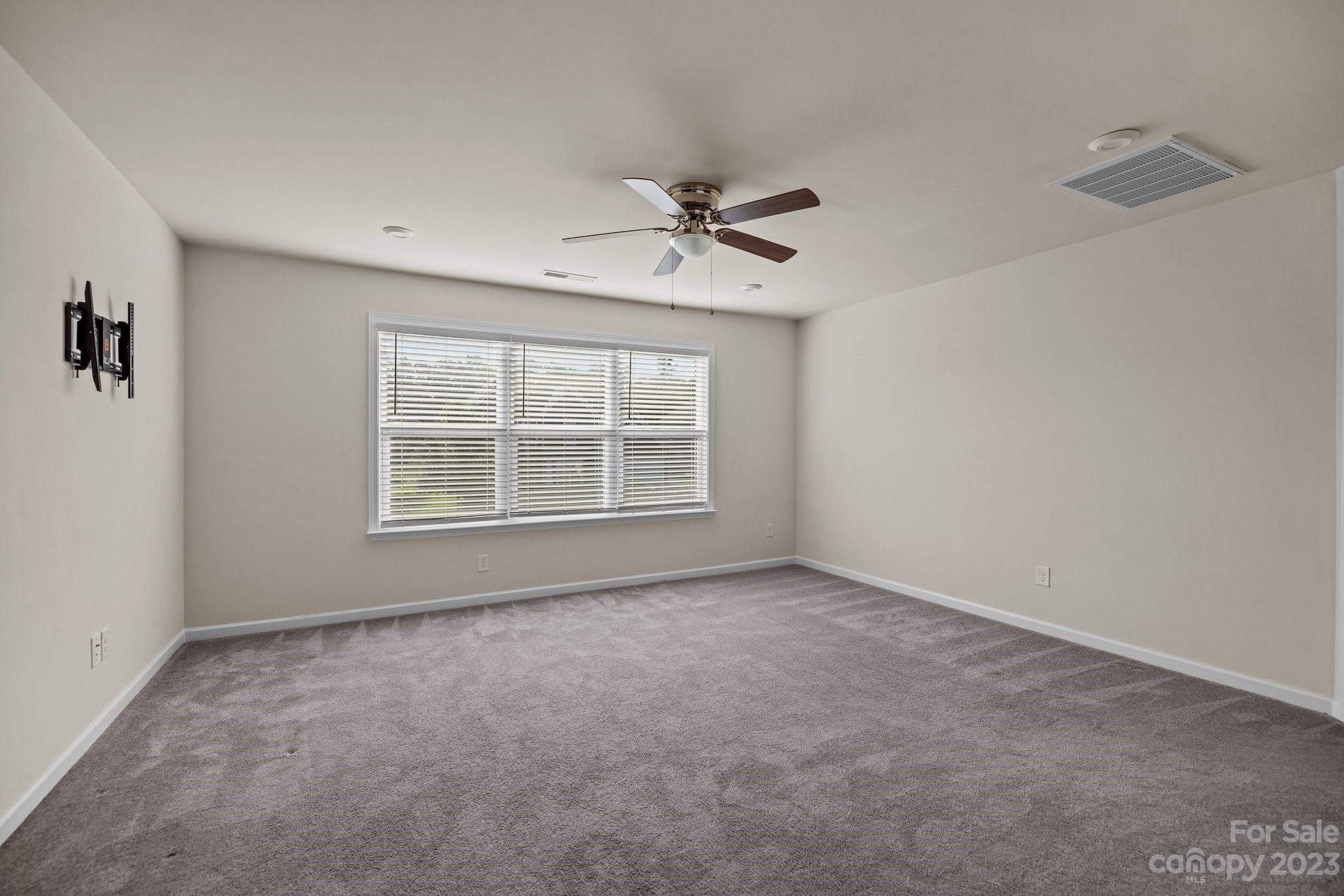 137 Hampton Trail Drive Fort Mill, SC 29708 - Photo 38 of 48 an empty room with windows and fan
