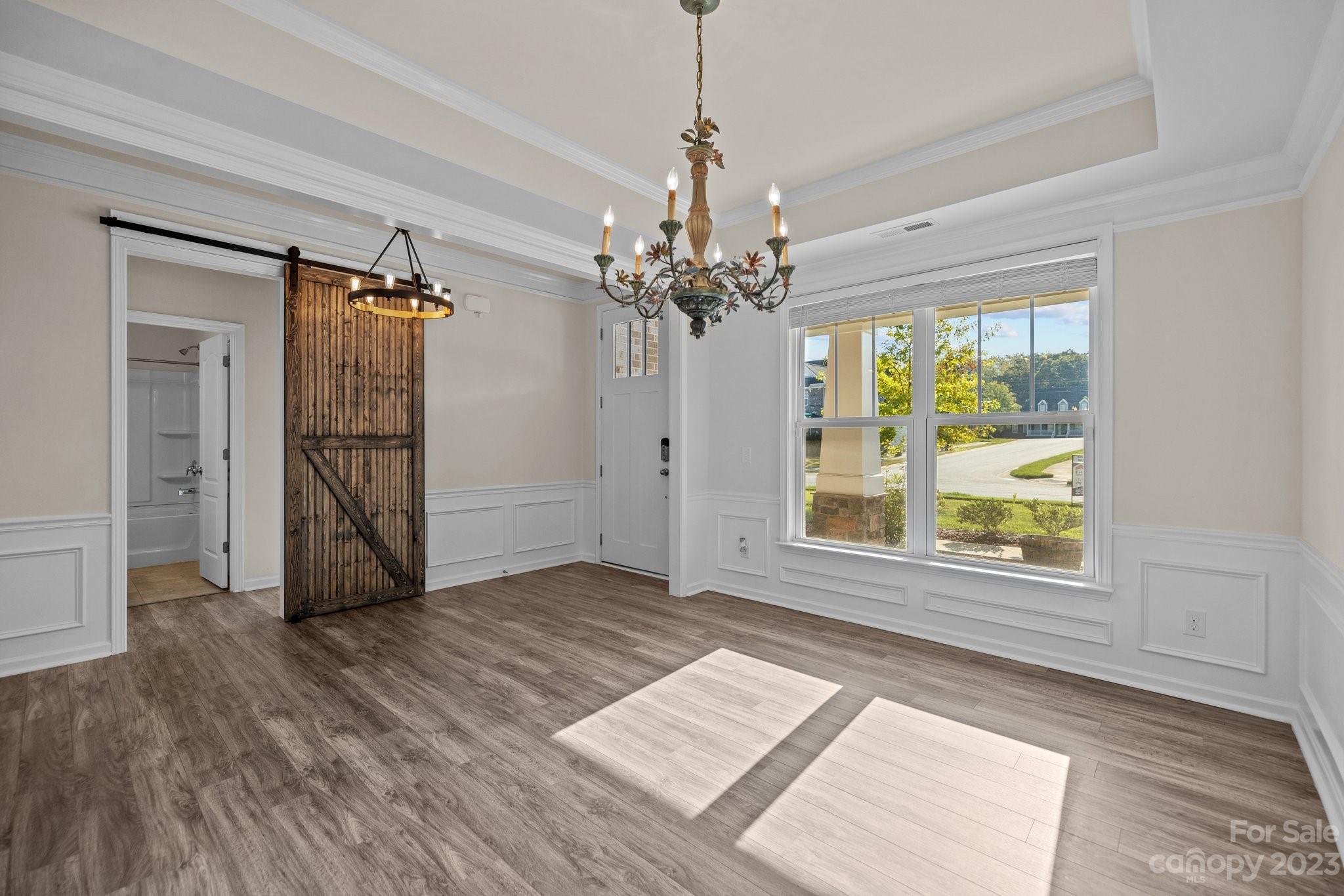 137 Hampton Trail Drive Fort Mill, SC 29708 - Photo 8 of 48 an empty room with wooden floor cabinet and windows