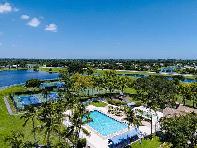an aerial view of a house with a swimming pool yard and outdoor seating