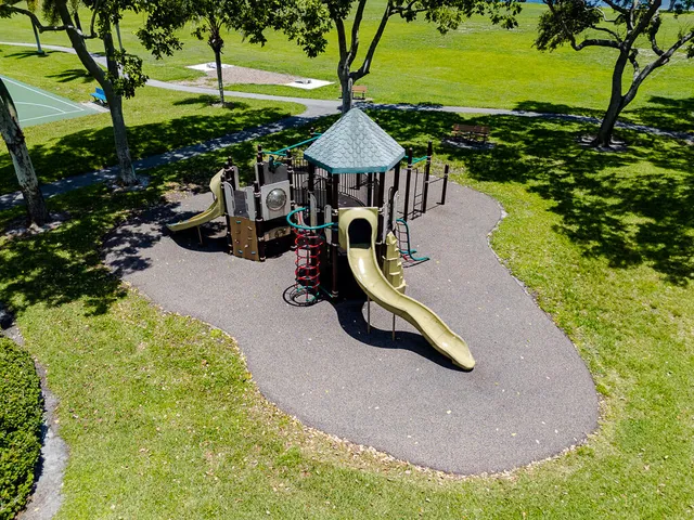 a view of a swimming pool with sitting area
