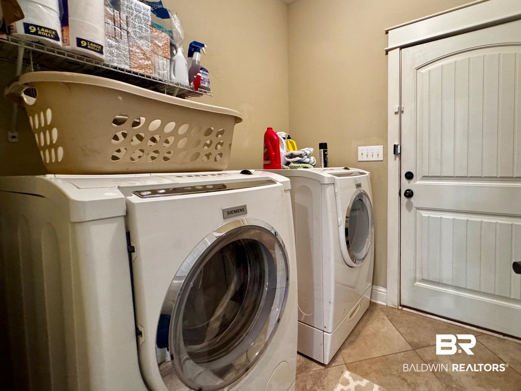 1030 Crown Walk Drive Foley, AL 36535 - Photo 29 of 40 Laundry room featuring light tile patterned floors, laundry area, and separate washer and dryer