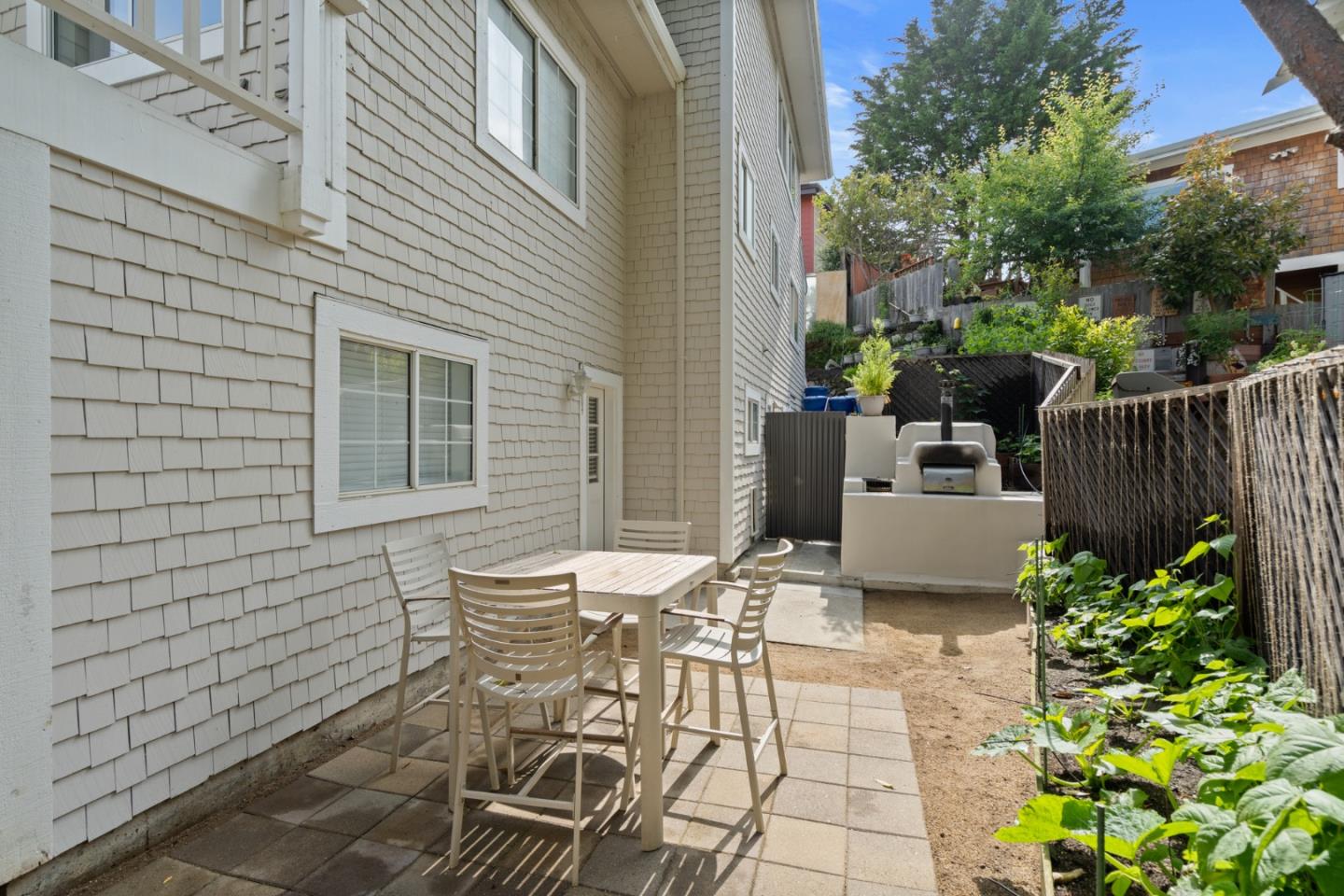 57 Sunset Drive Watsonville, CA 95076 - Photo 20 of 44 a view of a patio with table and chairs and potted plants