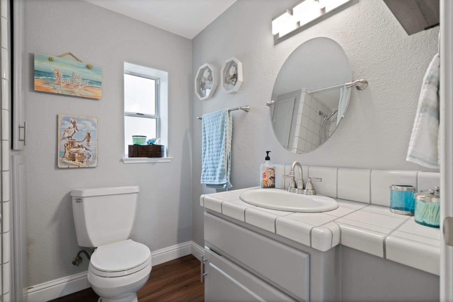 57 Sunset Drive Watsonville, CA 95076 - Photo 21 of 44 a bathroom with a toilet sink and mirror