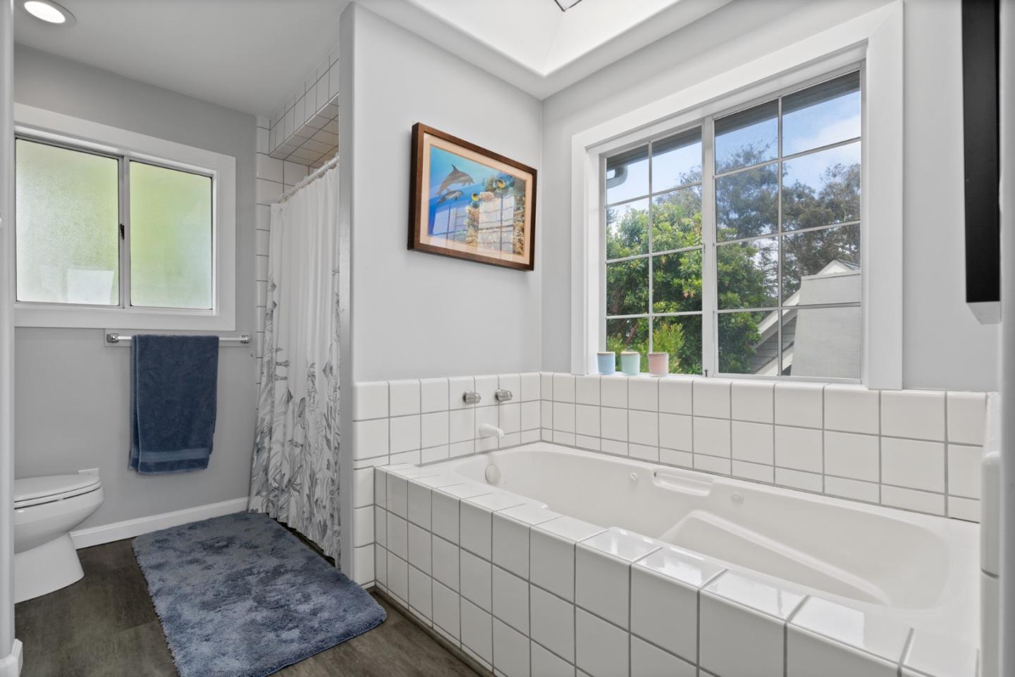 57 Sunset Drive Watsonville, CA 95076 - Photo 26 of 44 a bathroom with a bathtub and window