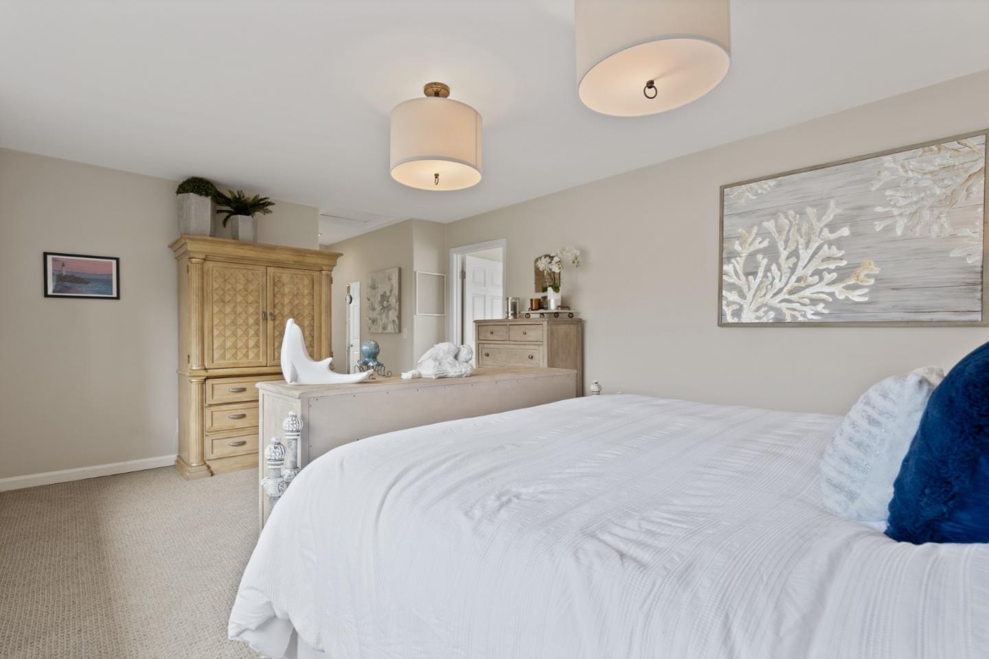 57 Sunset Drive Watsonville, CA 95076 - Photo 27 of 44 a large white bed in a white room