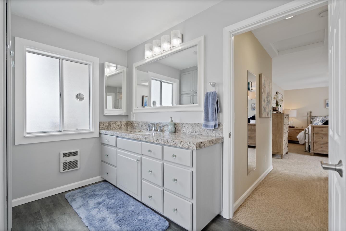 57 Sunset Drive Watsonville, CA 95076 - Photo 30 of 44 a bathroom with a granite countertop sink mirror and a