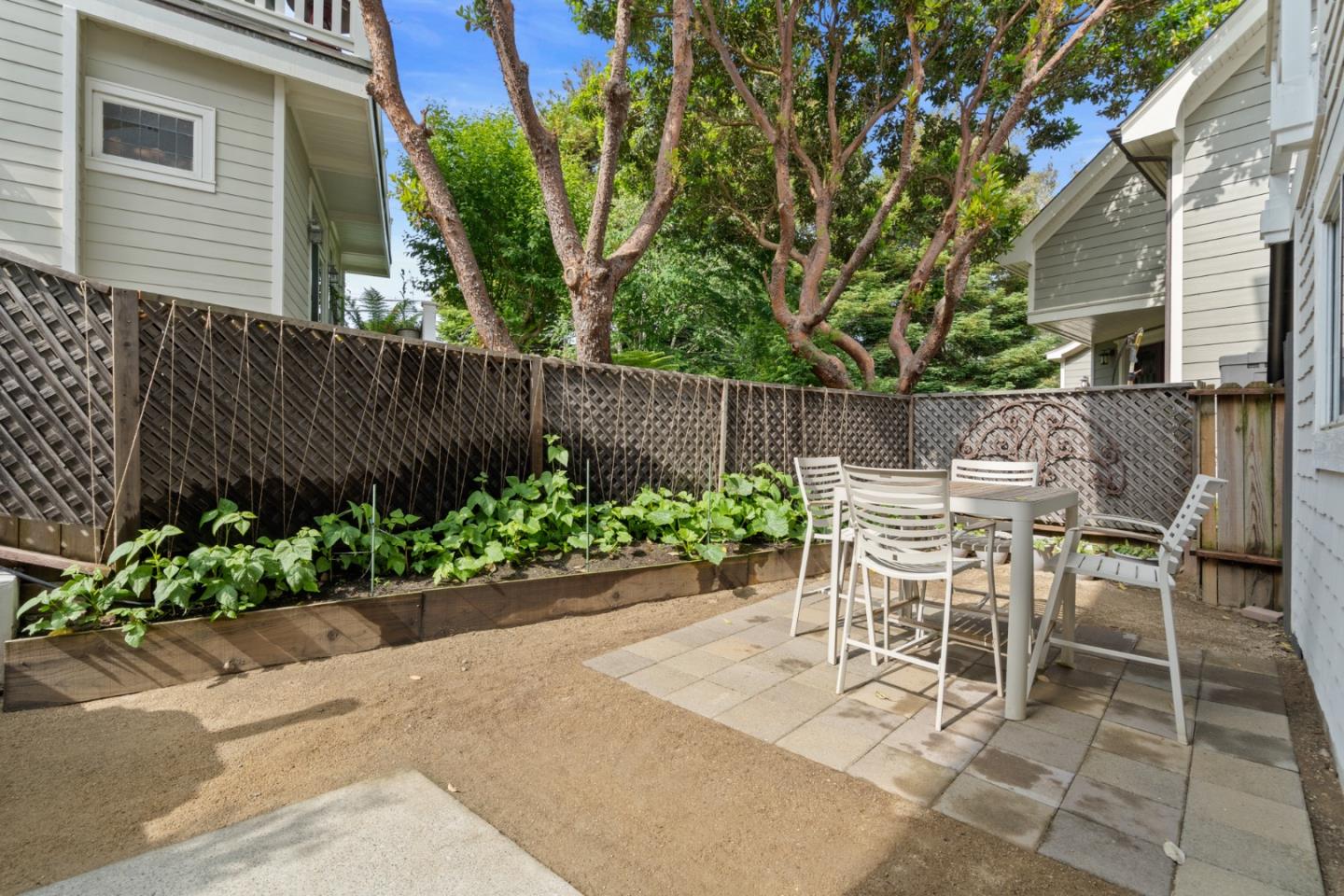 57 Sunset Drive Watsonville, CA 95076 - Photo 37 of 44 a view of a chairs and table in the back yard of a house