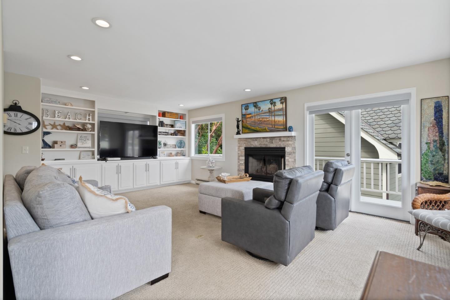 57 Sunset Drive Watsonville, CA 95076 - Photo 6 of 44 a living room with furniture fireplace and a flat screen tv