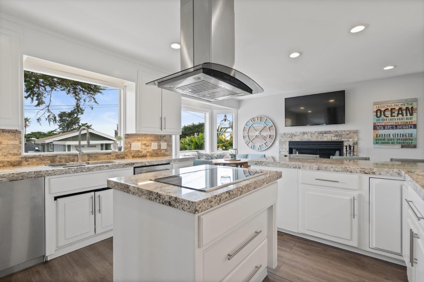 57 Sunset Drive Watsonville, CA 95076 - Photo 8 of 44 a kitchen with granite countertop a sink stove and cabinets