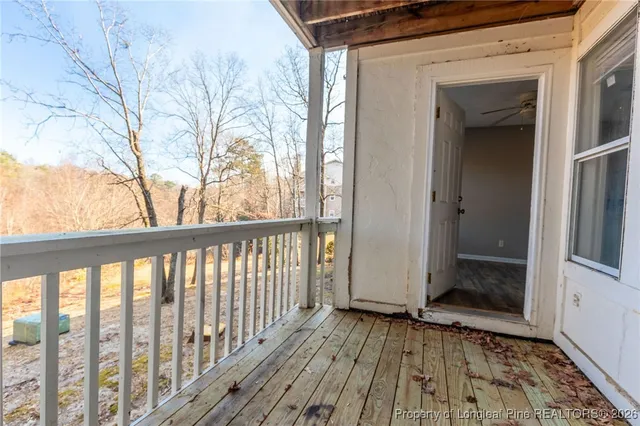 a view of a balcony with wooden floor