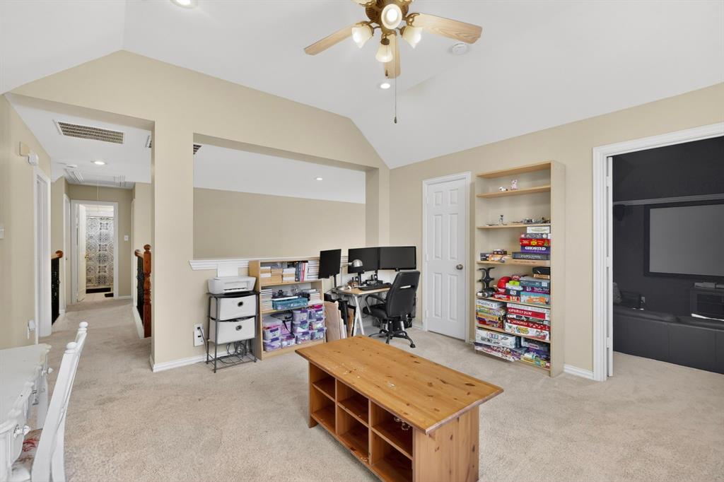 4004 White Porch Road Plano, TX 75024 - Photo 32 of 40 a room with furniture and a chandelier