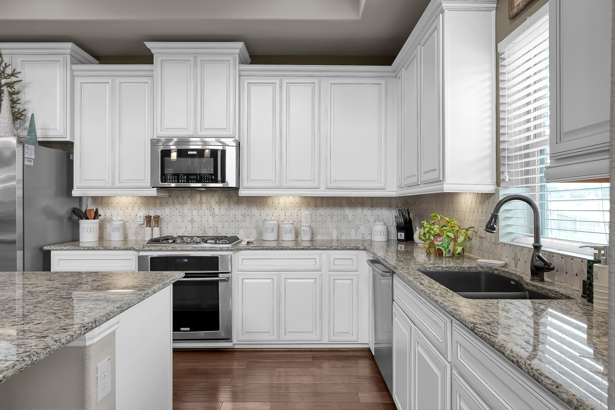 21926 Shamion Court Spring, TX 77379 - Photo 18 of 50 Stone sink and built in stove/oven and dishwasher.