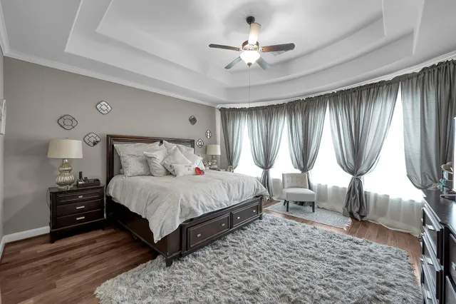 a room with a wooden floor and book shelf