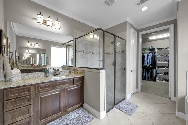 a bedroom with furniture and a flat screen tv
