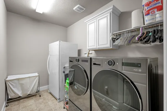 a view of walk in closet with clothes