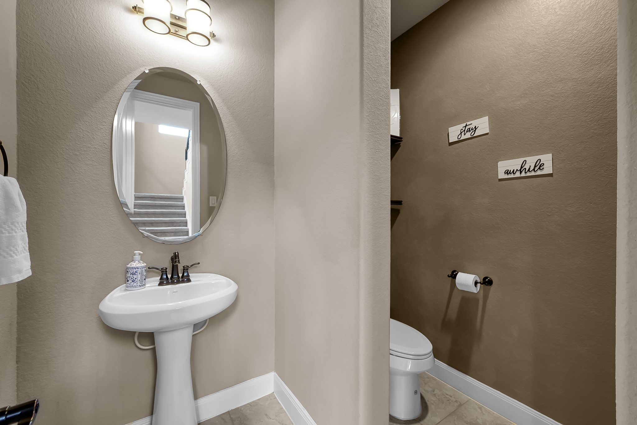 21926 Shamion Court Spring, TX 77379 - Photo 9 of 50 Half bath just outside the study in the hall.