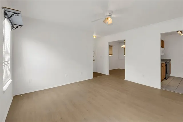 a view of a big room with closet and chandelier fan