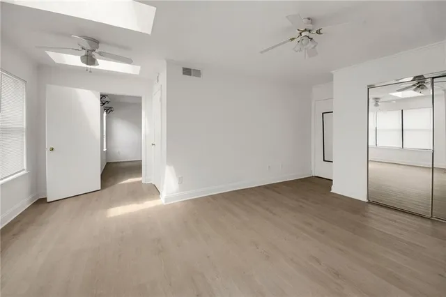 a view of an empty room with a window