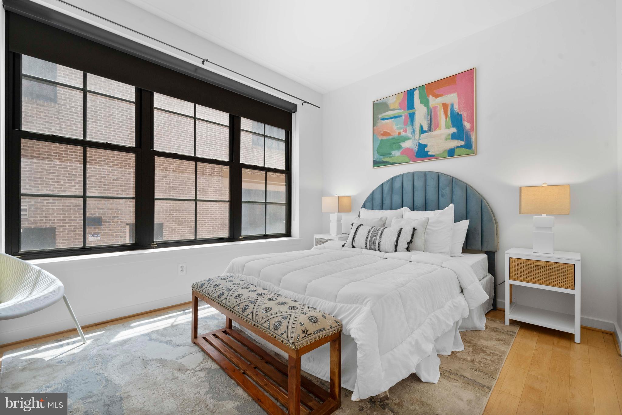 2412 17th Street Northwest, Unit 102 Washington, DC 20009 - Photo 14 of 21 a bedroom with a bed and a large window