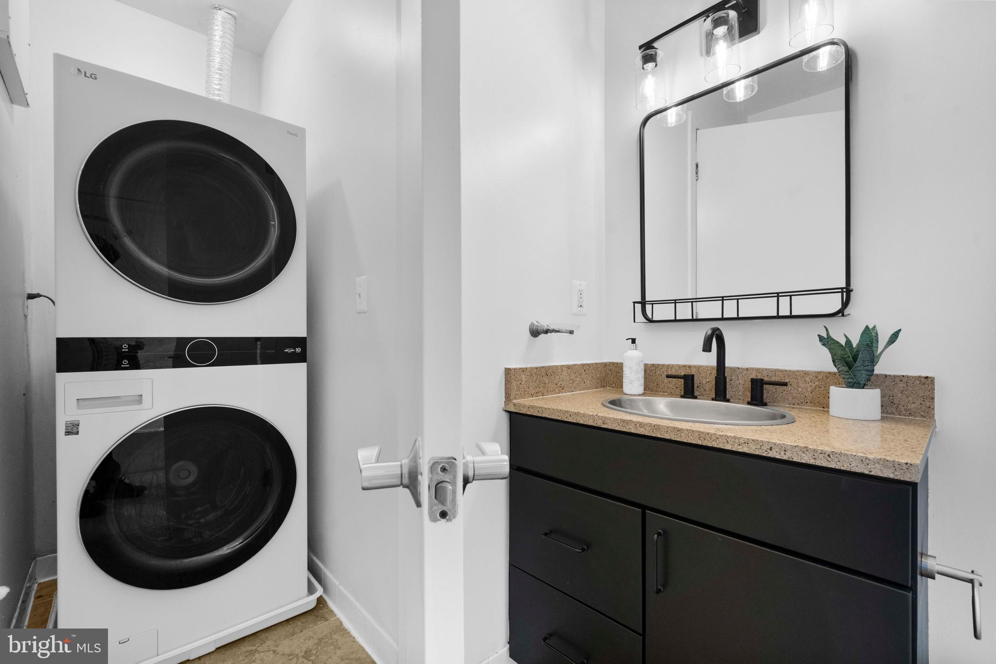 2412 17th Street Northwest, Unit 102 Washington, DC 20009 - Photo 18 of 21 a utility room with sink dryer and washer