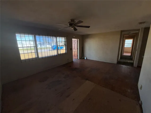 a view of an empty room with a window