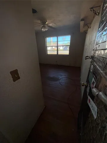 a view of an empty room and window