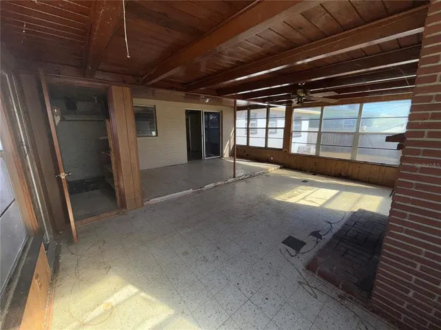 a view of empty room with windows