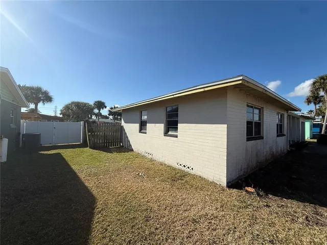 a house view with a backyard space