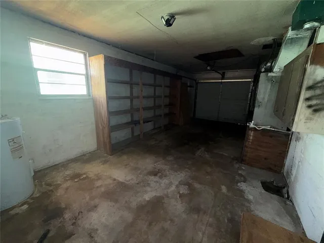 a view of an empty room with a fireplace