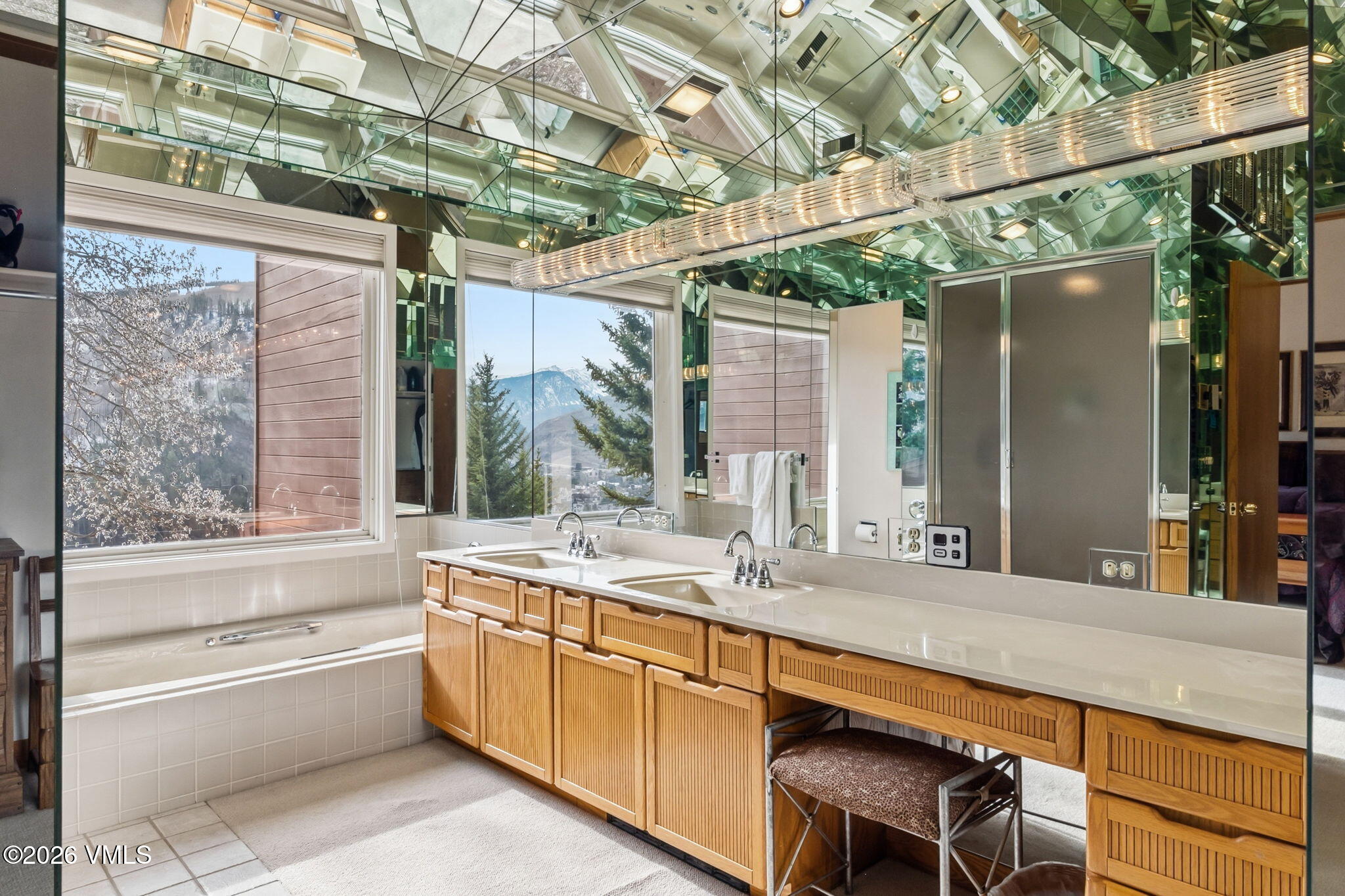 1460 Ridge Lane, Unit D Vail, CO 81657 - Photo 7 of 18 a bathroom with a granite countertop sink and a large mirror