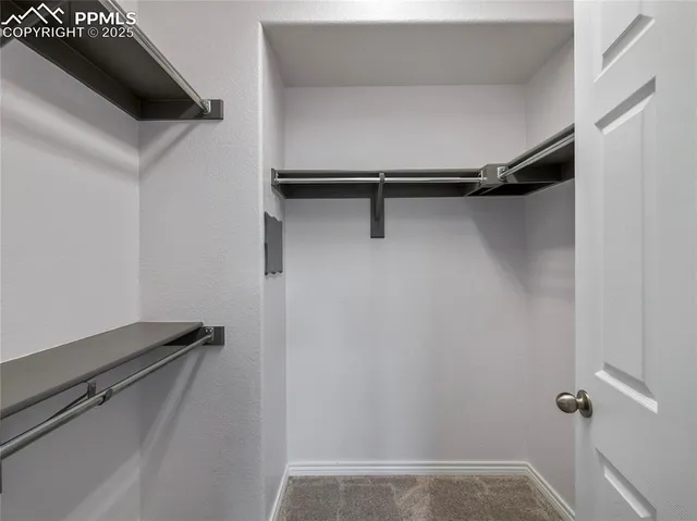 a bathroom with a granite countertop sink a mirror and shower