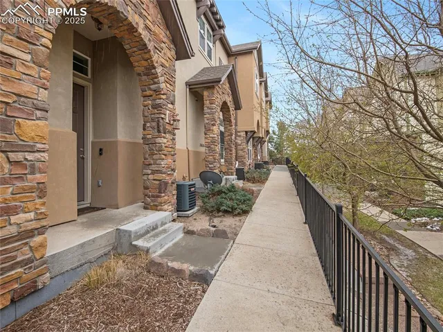 a view of a pathway both side of house