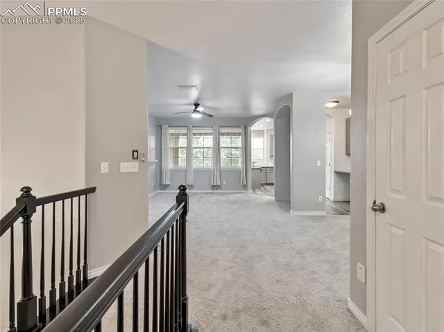 a view of a hallway with windows