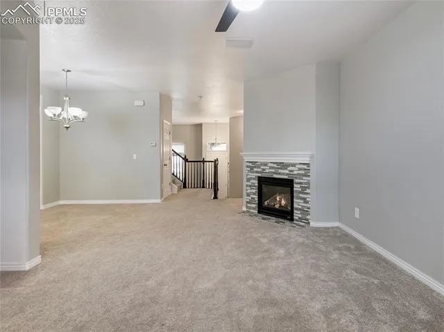a view of livingroom with fireplace and window