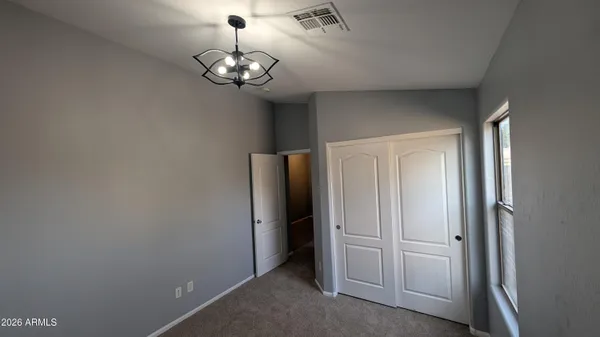 a view of a hallway with a chandelier