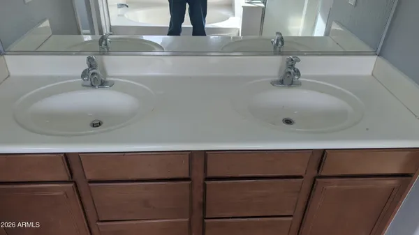 a bathroom with a sink and mirror