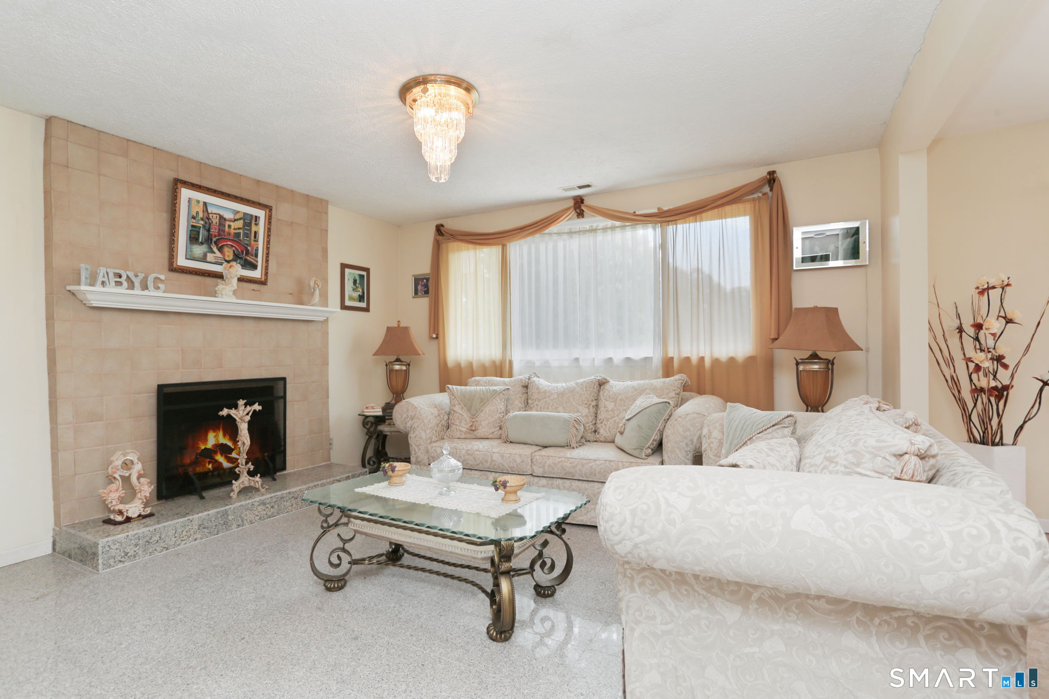 421 Strong Street East Haven, CT 06512 - Photo 11 of 30 a living room with furniture and a fireplace