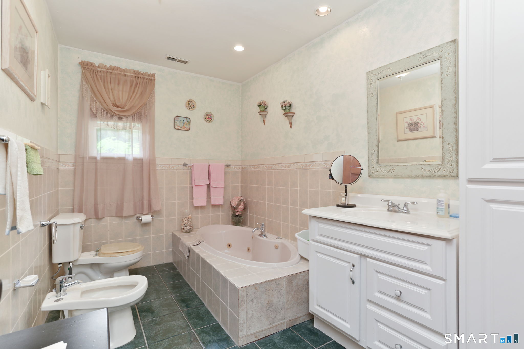 421 Strong Street East Haven, CT 06512 - Photo 16 of 30 a bathroom with a sink toilet and mirror