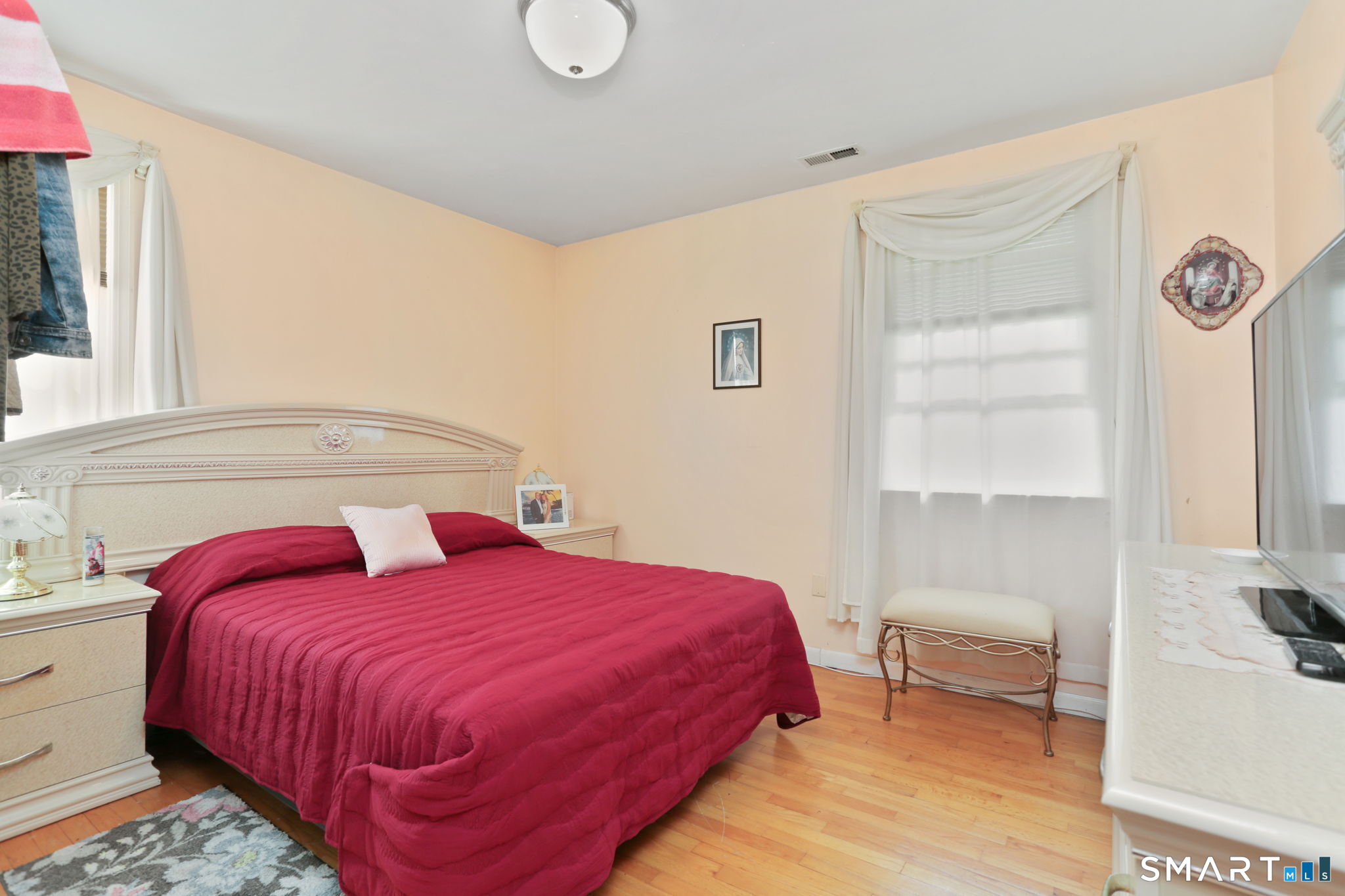 421 Strong Street East Haven, CT 06512 - Photo 17 of 30 a bedroom with a bed and a window