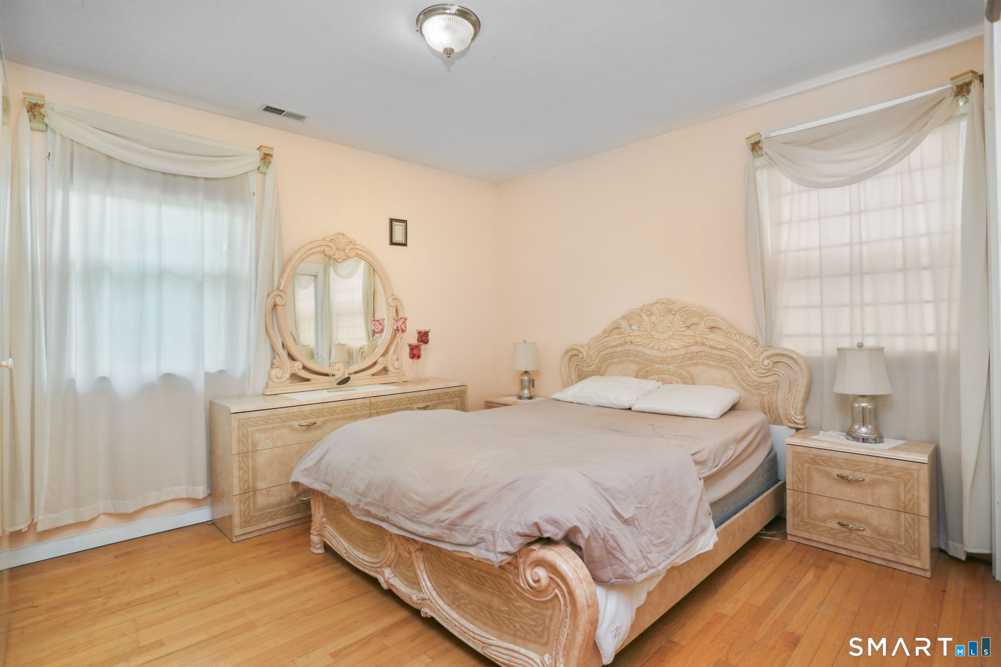 421 Strong Street East Haven, CT 06512 - Photo 18 of 30 a bedroom with a bed and a dresser
