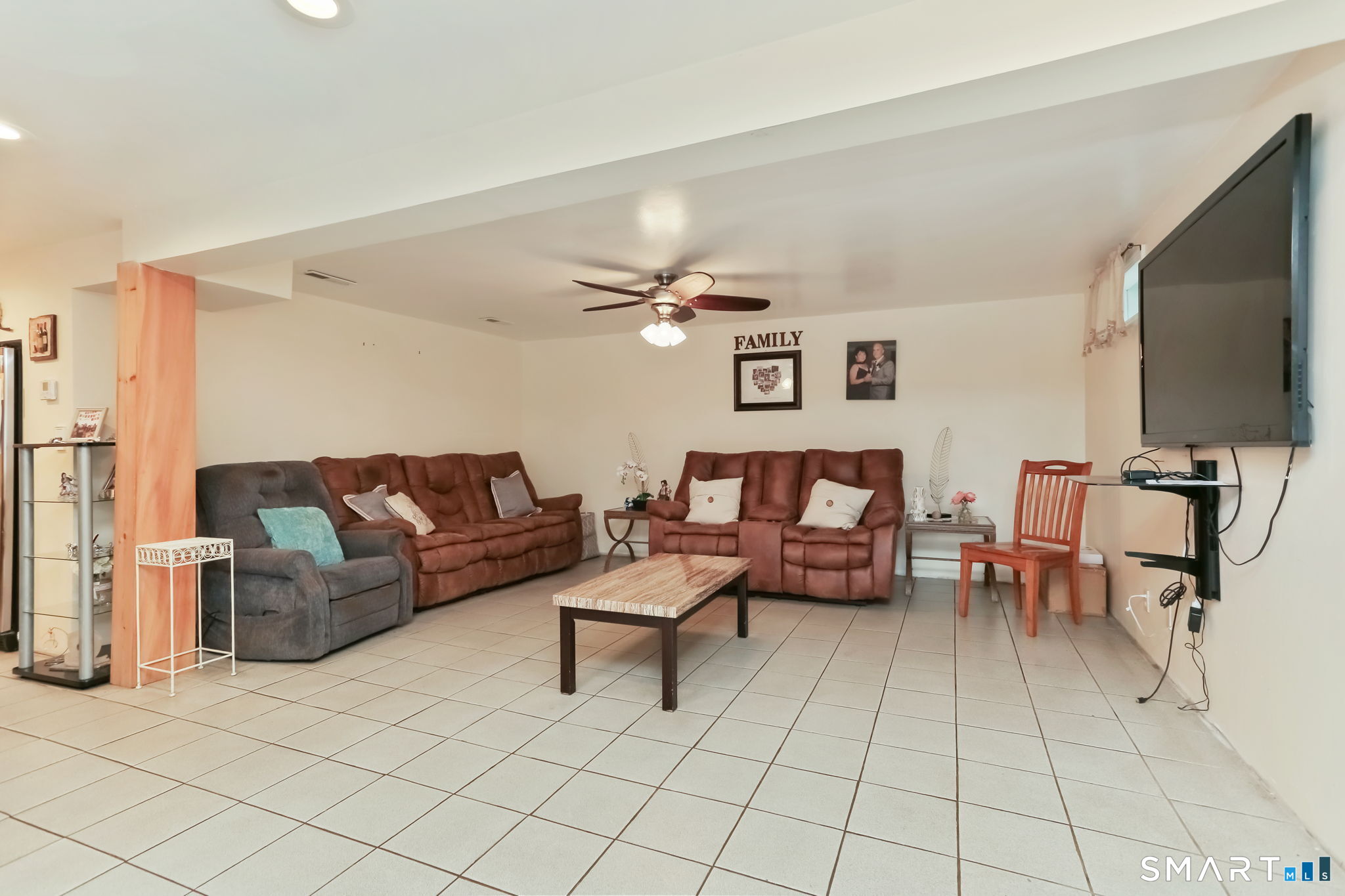 421 Strong Street East Haven, CT 06512 - Photo 21 of 30 a living room with furniture and a flat screen tv