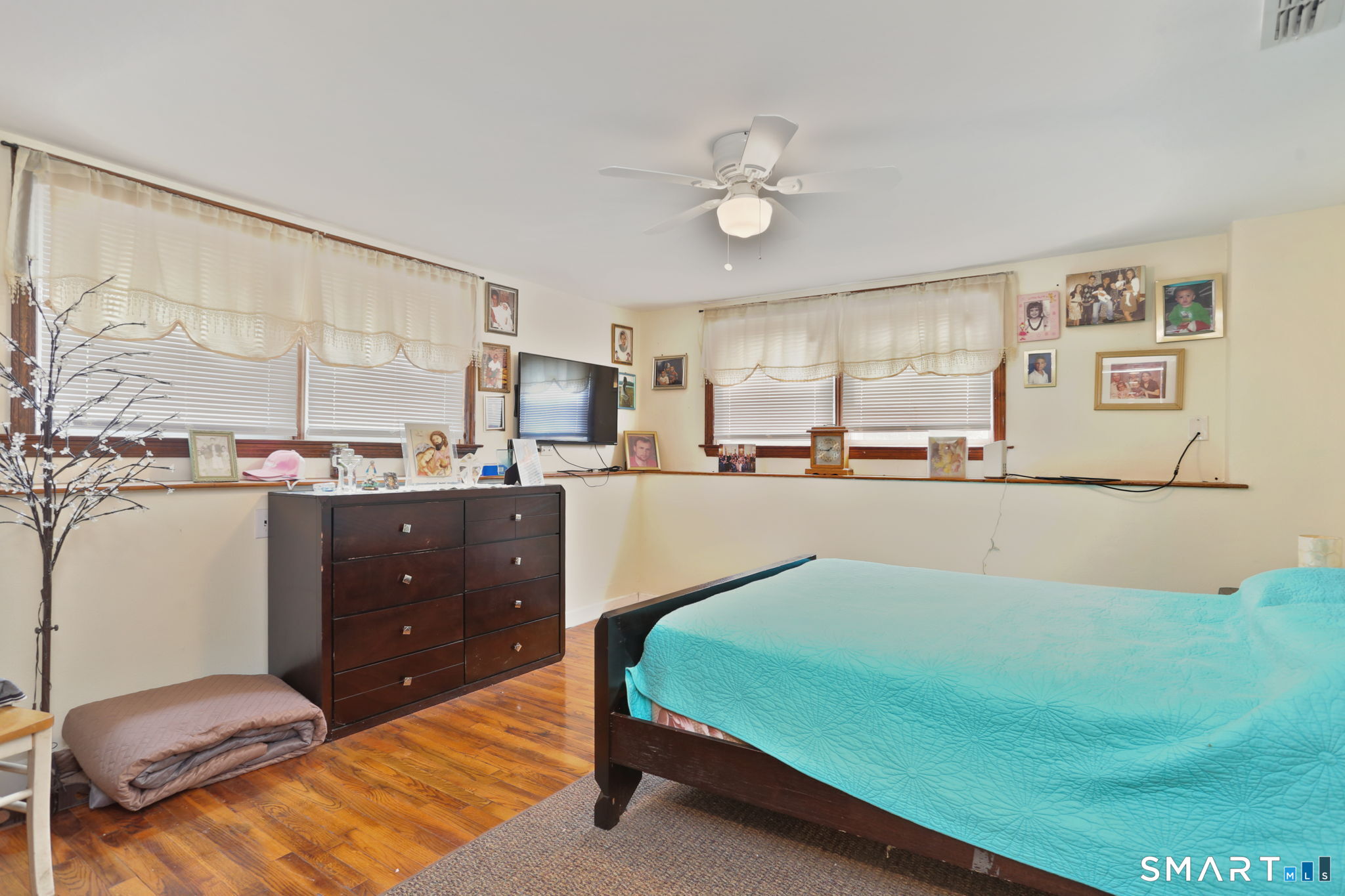 421 Strong Street East Haven, CT 06512 - Photo 25 of 30 a bedroom with a bed window and couch