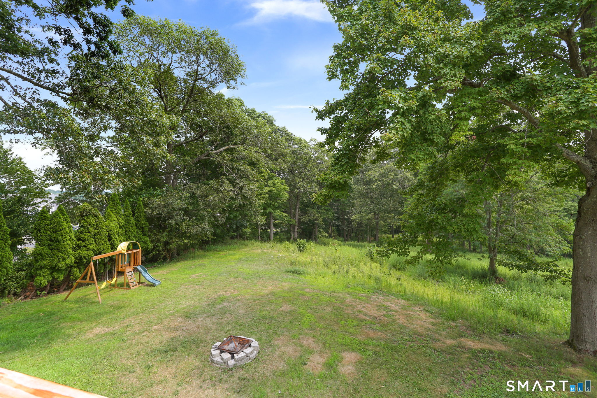 421 Strong Street East Haven, CT 06512 - Photo 29 of 30 a backyard of a house with lots of green space