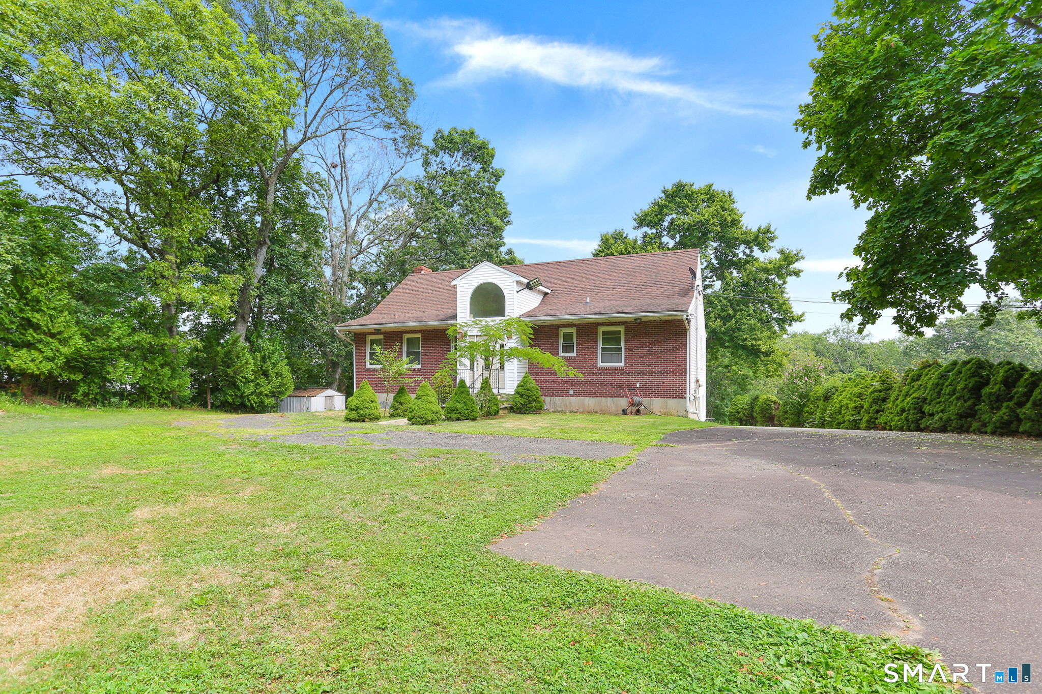 421 Strong Street East Haven, CT 06512 - Photo 6 of 30 a front view of a house with a yard and trees