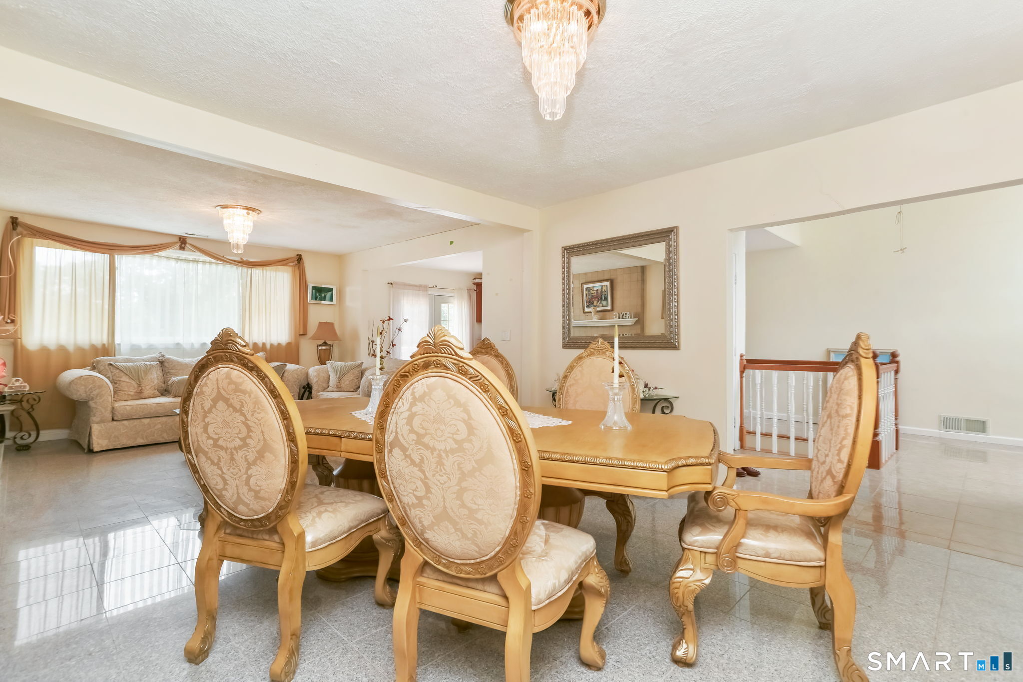 421 Strong Street East Haven, CT 06512 - Photo 10 of 30 a dining room with furniture and a chandelier