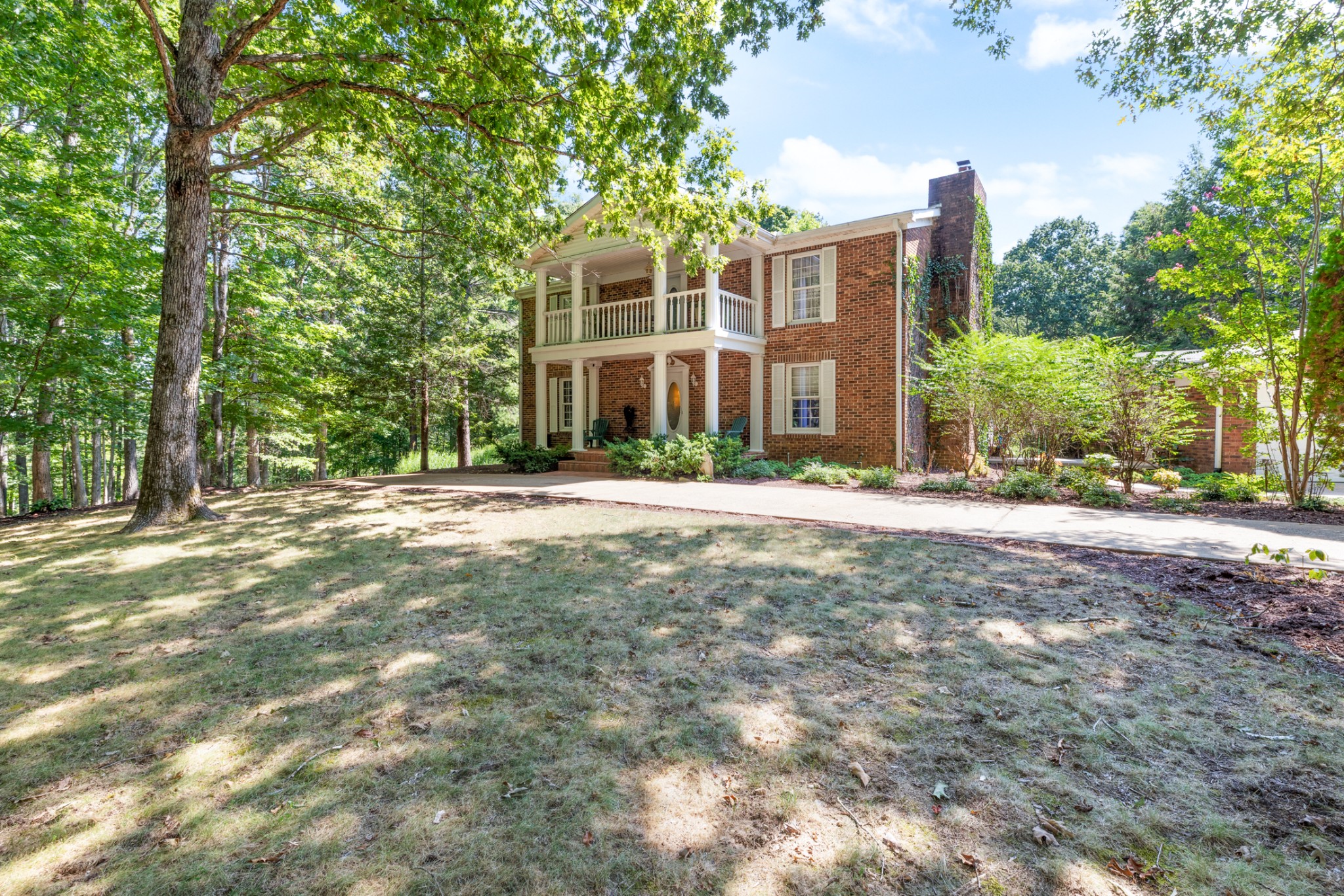 7422 Indian Creek Road McEwen, TN 37101 - Photo 1 of 71 a front view of a building with a garden